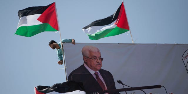 A poster of Palestinian President Mahmoud Abbas in the West Bank city of Nablus. Abbas is expected to meet President Biden next week in the West Bank. 