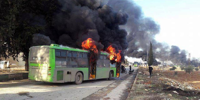 bus burning syria