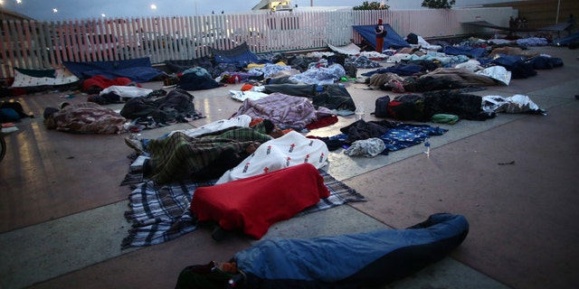 Members of a caravan of migrants from Central America spent the night near the San Ysidro checkpoint after a small group of fellow migrants entered the United States border and customs facility, where they are expected to apply for asylum, in Tijuana, Mexico April 29, 2018.