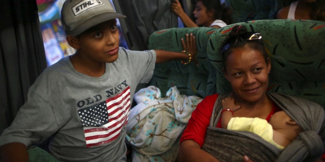 Central American migrants, moving in a caravan through Mexico, travel to Mazatlan, as part of their new travel route, in Tlaquepaque, in Jalisco state, Mexico, April 19, 2018.
