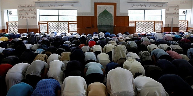 Men participate in the Friday prayer in The Grand Mosque of Copenhagen, officially known as the Hamad Bin Khalifa Civilisation Center, a Sunni mosque popular with residents of nearby Mjolnerparken.