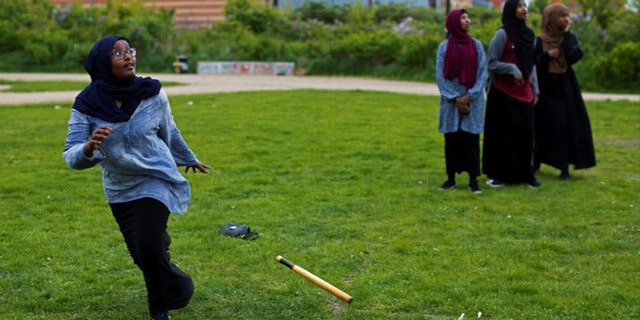 A group of women of Somali descent play rounders in a park in Mjolnerparken, a housing estate featured on the Danish government's "Ghetto List."
