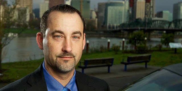 TownCar.com owner Mike Porter near the Hawthorne Bridge in Portland, OR