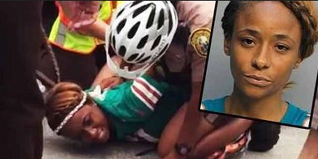 Miko Grimes was arrested before one of her husband's games last September. (Associated Press)