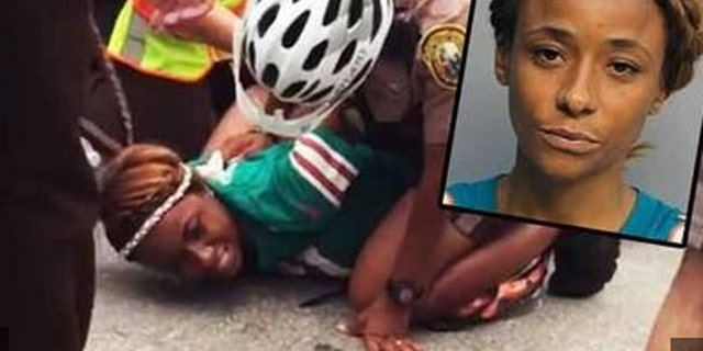 Miko Grimes was arrested before one of her husband's games last September. (Associated Press)