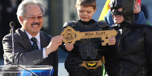 Nov. 15, 2013: Five-year-old leukemia survivor Miles Scott, dressed as Batkid, receives a key to the city declaring him Junior Mayor from San Francisco from Mayor Ed Lee, left, during a ceremony as part of a day arranged by the Make-A-Wish Foundation in San Francisco, Calif.