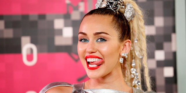 August 30, 2015. Singer and show host Miley Cyrus arrives at the 2015 MTV Video Music Awards in Los Angeles, California.