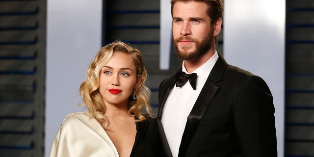 Miley Cyrus and Liam Hemsworth arrive at the 2018 Vanity Fair Oscar Part on March 04, 2018.