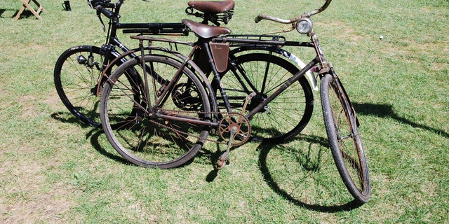 A pair of Swiss Army Bikes. Hundreds of these bikes were sold off as military surplus in the 1990s and when maintained can still be ridden today. The front bike likely dates to the 1930s or possibly earlier and has a simple front brake that literally is lowered on the tire when the brake is engaged. The rear bike is a post-war version, and each has only a single gear! (Photo: Peter Suciu, Private Collection)
