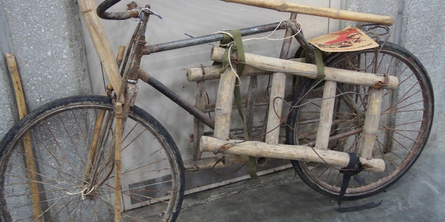 A pre-World War II French bicycle that has been heavily modified to move material on the infamous "Ho Chi Minh Trial" in Southeast Asia during the Vietnam War. This bike couldn't be ridden but instead served a role like a pack mule. It was offered for sale at a collector's show. (Photo: Peter Suciu, Private Collection)