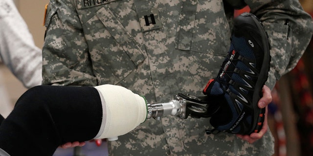 A wounded soldier receives treatment at a rehabilitation center at Walter Reed National Military Medical Center in Bethesda, Maryland, May 10, 2013. A new kind of technology may hold the key to prostheses that feel.