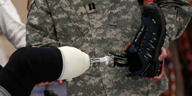 A wounded soldier receives treatment at a rehabilitation center at Walter Reed National Military Medical Center in Bethesda, Maryland, May 10, 2013. A new kind of technology may hold the key to prostheses that feel.