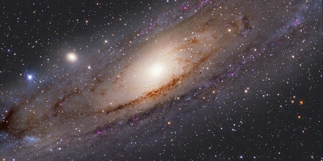 The Andromeda galaxy, with satellite galaxies M32 (center left) and M110 (lower right). A new study suggests that M32 is the remnant of a much larger galaxy gobbled up by Andromeda about 32 billion years ago. Credit: S. Ozime
