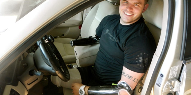 Thanks to his prosthetic limbs, Travis Mills can do many of the activities he once could including driving.