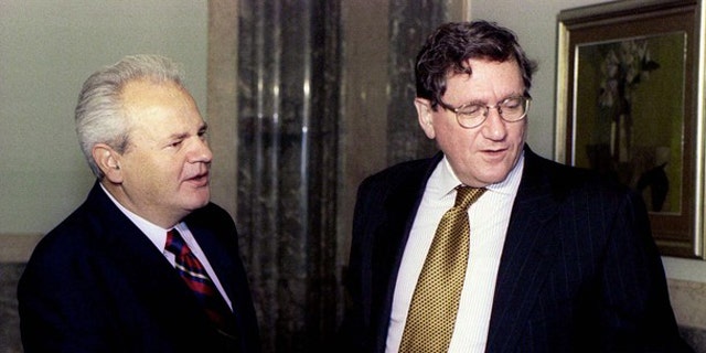 Sept. 15, 1996: Then-Serbian President Slobodan Milosevic and U.S. peace envoy Richard Holbrooke, right, shake hands at the beginning of a meeting in Belgrade. (Reuters)