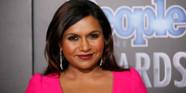December 18, 2014. Actress Mindy Kaling poses backstage at the People Magazine Awards in Beverly Hills, California.