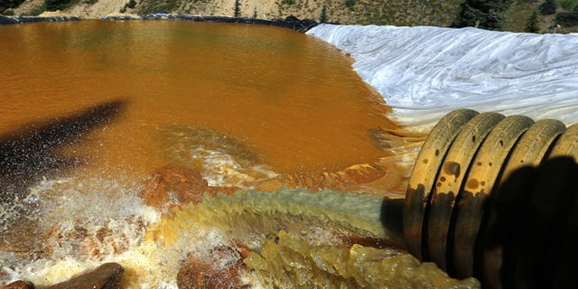 Aug. 14, 2015: Water flows through a series of sediment retention ponds built to reduce heavy metal and chemical contaminants from the Gold King Mine wastewater accident, in the spillway about 1/4 mile downstream from the mine, outside Silverton, Colo.