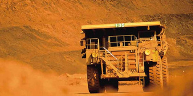 Truckers and train drivers who haul iron ore in Australia's remote Pilbarra region earn an average of $225,000 a year, but the companies that employ them are replacing them with robots. (Handout: BHP Billiton)