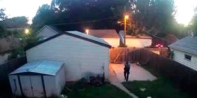 A Minneapolis police officer was caught on surveillance video shooting two dogs in a backyard on Saturday.