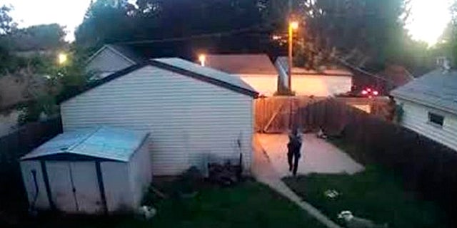 A Minneapolis police officer was caught on surveillance video shooting two dogs in a backyard on Saturday.