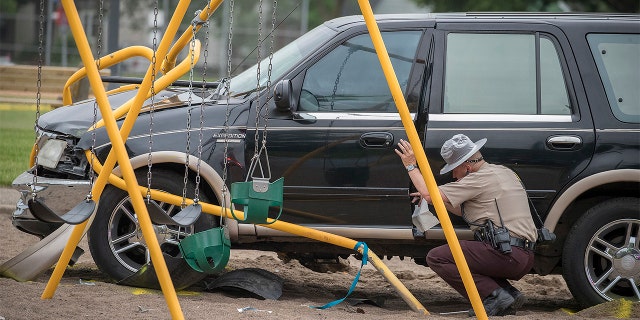 Minnesota State Patrol investigates the scene where a motorist being pursued by the State Patrol veered into a Minneapolis playground in June.