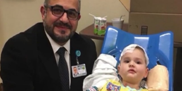 Lena, a 4-year-old with a brain tumor, received emergency surgery, performed by Dr. Samer K. Elbabaa, while on vacation in Florida, her parents, Matt and Erin Tietjen, told Fox 35.