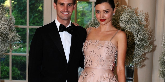 File photo: Evan Spiegel, Chief Executive Officer, Snapchat and model Miranda Kerr arrive for the state dinner in honor of the Nordic Summit at the White House in Washington, May 13, 2016. (Reuters)