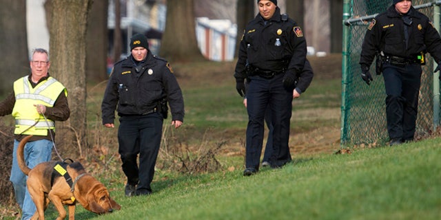 In this Friday, Jan. 1, 2016, photo, Allentown, Pa., police use a search and rescue dog in Keck Park as the search continues for Jayliel Vega Batista, a missing 5-year-old autistic boy who wandered off from a New Year's Eve party on Thursday night. (Chris Shipley/The Morning Call via AP)
