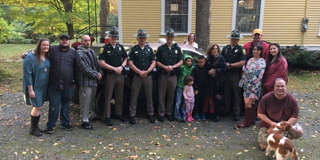 Photograph of the wedding party, along with members of New Hampshire State Police and NH Fish and Game.
