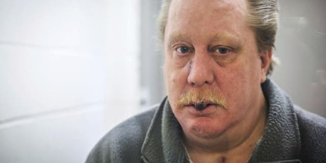 This undated photo provided by Jeremy Weis Photography, shows Russell Bucklew, who is scheduled to die by injection Tuesday, March 20, 2018, for killing a former girlfriend's new boyfriend in 1996 in eastern Missouri. Bucklew faces a potentially "gruesome and painful" execution because of a rare medical condition that compromises the man's veins and causes multiple tumors in his head and throat, his attorney said Sunday. (Jeremy Weis Photography via AP)