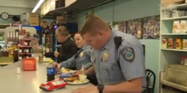 A "mystery man" is paying for local police officers at a deli in suburban St. Louis.