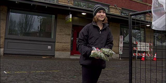 Madison Root, 11, holding some of the mistletoe she was told not to sell.