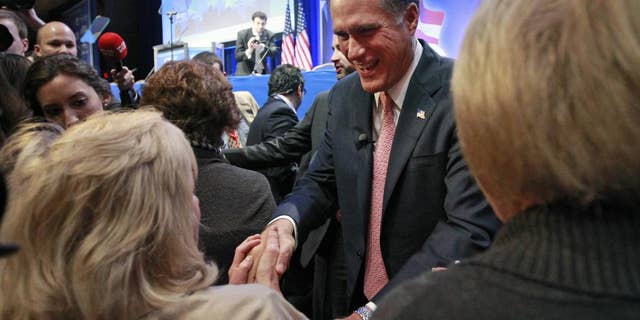 Mitt Romney shakes hands after speaking at the Conservative Political Action Conference (CPAC) in Washington, Friday, Feb. 11, 2011.(AP Photo/Alex Brandon)