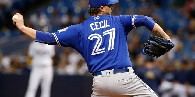 Sep 3, 2016; St. Petersburg, FL, USA; Toronto Blue Jays relief pitcher Brett Cecil (27) throws a pitch against the Tampa Bay Rays at Tropicana Field. Mandatory Credit: Kim Klement-USA TODAY Sports
