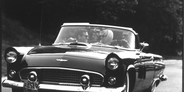 Milton Green, Monroe and Miller took advantage of the car's three-across bench seat.