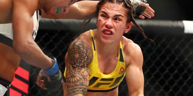 Feb 4, 2017; Houston, TX, USA; Jessica Andrade (red gloves) fights Angela Hill (blue gloves) during UFC Fight Night at Toyota Center. Mandatory Credit: Mark J. Rebilas-USA TODAY Sports