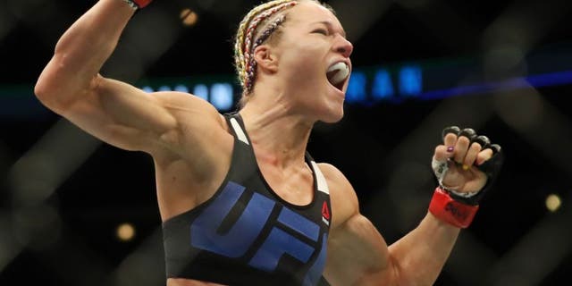 July 23, 2016; Chicago, IL, USA; Felice Herrig (red gloves) celebrates after defeating Kailin Curran (blue gloves) during UFC Fight Night at United Center. Mandatory Credit: Kamil Krzaczynski-USA TODAY Sports