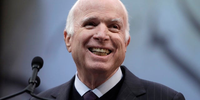 Sen. John McCain, R-Ariz., said in his upcoming memoir that he doesn't want to be buried at Arlington National Cemetery, but next to his old Navy pal Chuck Larson.