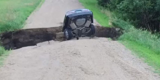 A Minnesota teen survived driving into a sinkhole.