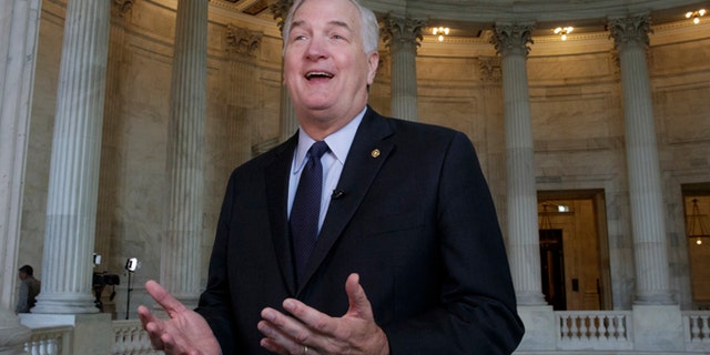 FILE - In this March 3, 2017 file photo, Sen. Luther Strange, R-Ala., who replaced Attorney General Jeff Sessions in the Senate, does a TV interview on Capitol Hill in Washington. President Donald Trump is endorsing Alabama Sen. Luther Strange in a special primary election next week. The presidential endorsement comes as some polls have suggested that Strange is in a tight race with former state chief justice Roy Moore and Rep. Mo Brooks, a member of the House Freedom Caucus. (AP Photo/J. Scott Applewhite, file)