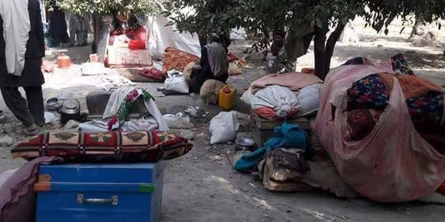 Displaced Afghans, forced out by ISIS fighting.