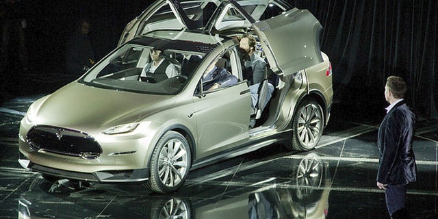 Elon Musk reveals Tesla Model X crossover concept
