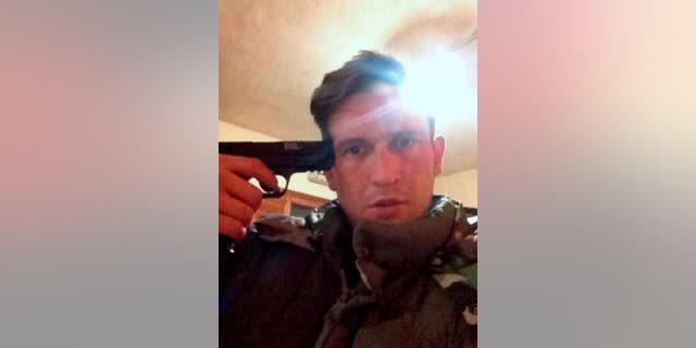 Dolak's ex Michael Goodwin, seen here posing with a gun to his own head in a social media photo, has been sentenced to over four years in prison.