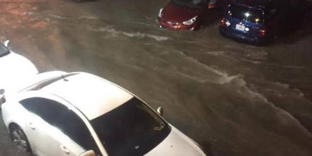 Vehicles are submerged in floodwaters in the Westport neighborhood of Kansas City Mo., Aug. 26, 2016. (Kathy Lu /The Kansas City Star via AP)