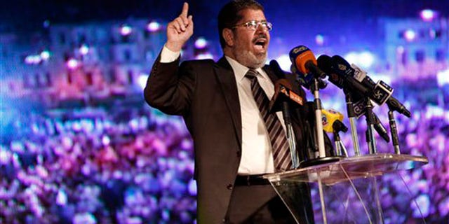 May 20, 2012: In this file photo, Muslim Brotherhood's president-elect Mohammed Morsi speaks at his last rally in Cairo, Egypt.
