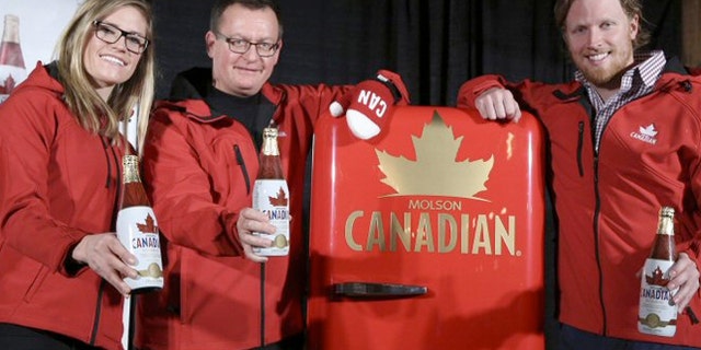 Ferg Devins of Molson Coors Canada (center) with Canadian Olympic hopefuls Georgia Simmerling (left) and Cody Sorensen.