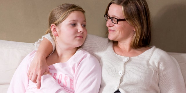 Mother and daughter having conversation