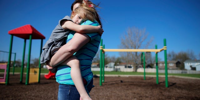 May 9, 2014- Mother and daughter at a playground in Winthrop Harbor, Illinois. (REUTERS)