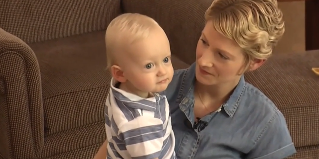 Stacey Johnson, who is still battling breast cancer, poses with her nearly one-year-old son, William.