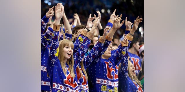 Kansas fans set a world record for largest gathering of people wearing holiday sweaters.